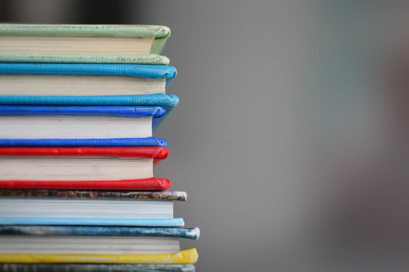 Stack of bound volumes on a reading table